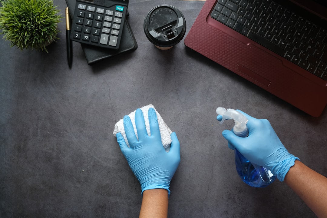 services-06 person-in-blue-long-sleeve-shirt-sitting-beside-black-laptop-computer-9gpkrsbgmc